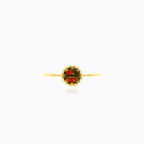 Solitaire garnet yellow gold ring with crown details
