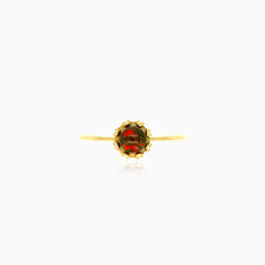 Solitaire garnet yellow gold ring with crown details