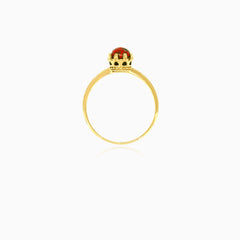 Solitaire garnet yellow gold ring with crown details