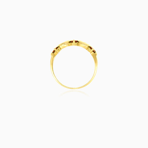 Anillo elegante de granate y circonita en oro