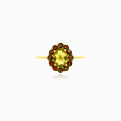 Moldavite and garnet ring in yellow gold