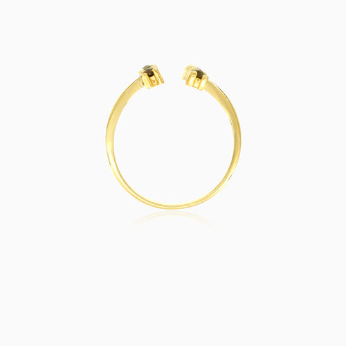 Gold ring with garnets along finger