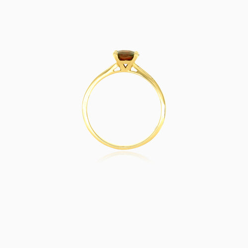 Yellow gold ring with one round garnet