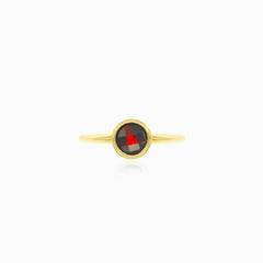 Simple yellow gold ring with solitaire garnet