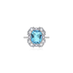 Bague halo en topaze bleue taille coussin