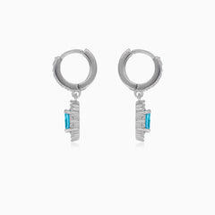 Halo silver dangling earrings with blue topaz