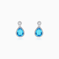 Halo sterling silver drop earrings with blue topaz