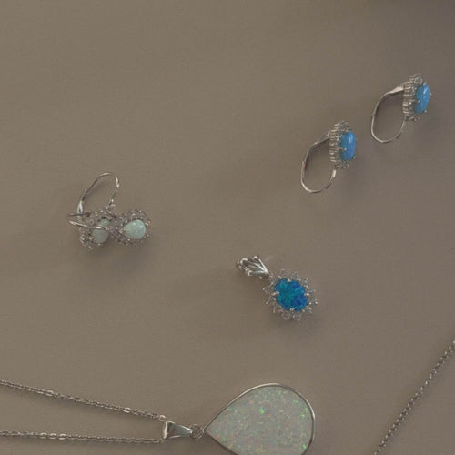 Sterling silver halo white pear opal earrings