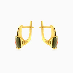 Goldene Tropfen mit strahlender Ausstrahlung