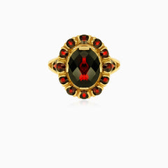 Bague artisanale en or avec barre sertie de grenat