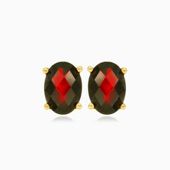 Pendientes de botón ovalados con granate en oro amarillo de 14 quilates