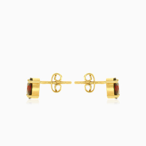 Pendientes de botón ovalados con granate en oro amarillo de 14 quilates