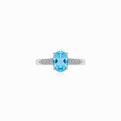 Bague en argent avec topaze bleue et zircon cubique