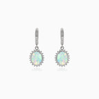 Silver hanging earrings with white opal