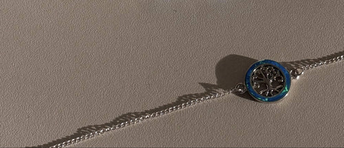 Stříbrné náušnice s modrým oválným opálem