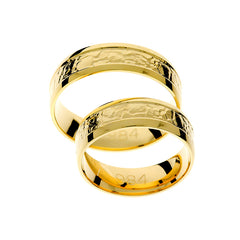 Bague de mariage en or jaune avec détail au centre