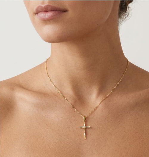 Gedrehtes Kreuz aus Gelbgold mit Zirkonia