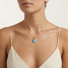 Blue opal halo gold pendant