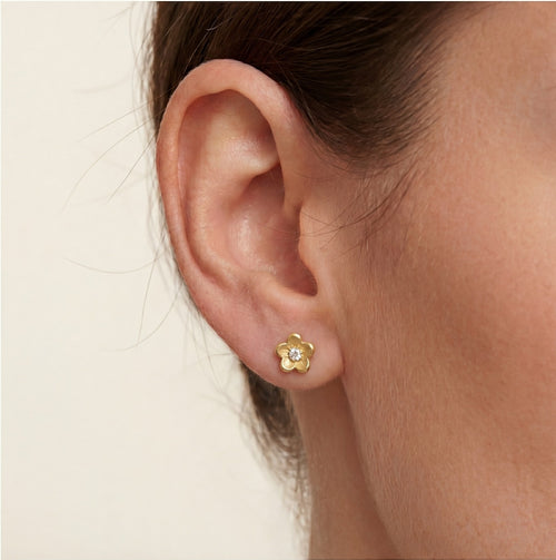 Lustrous yellow gold flower with cubic zirconia earrings