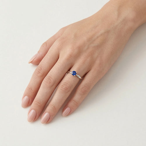Simple white gold ring with sapphire