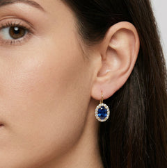 Oval blue quartz in gold earrings