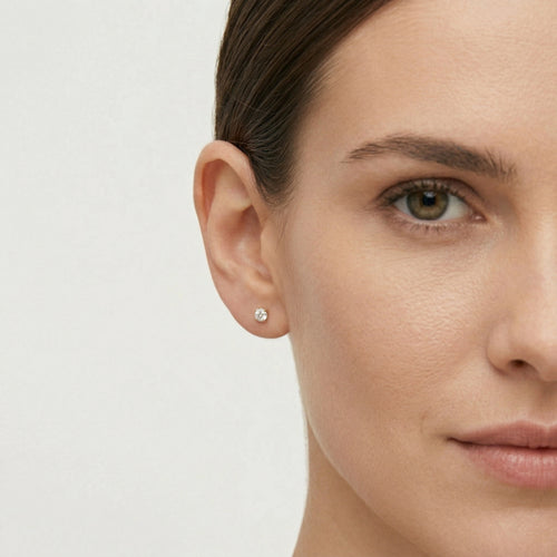 Yellow gold stud earrings with round cubic zirconia