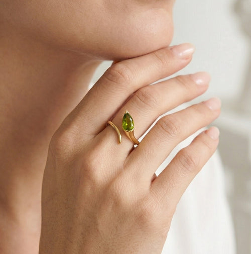 Gold ring with pear cut moldavite
