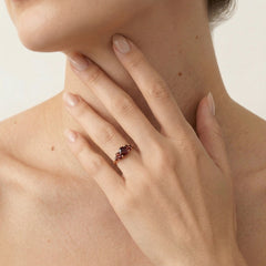 Yellow gold ring with round cut garnets