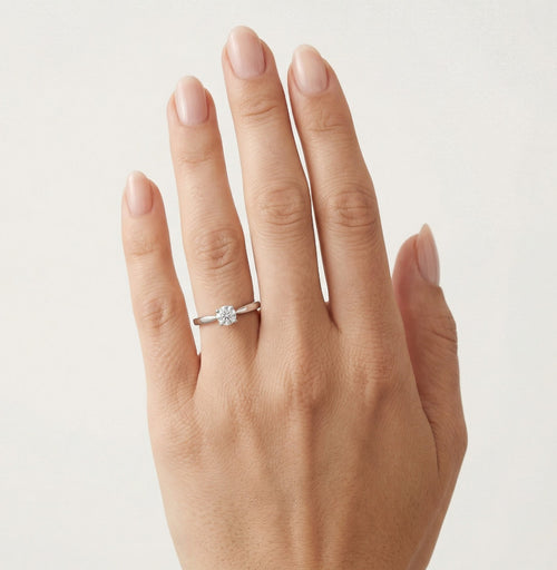 Elegant four prong set silver ring