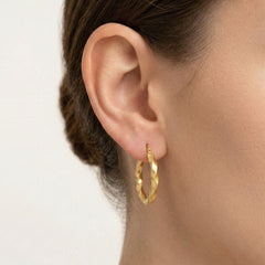 Curved yellow gold earrings