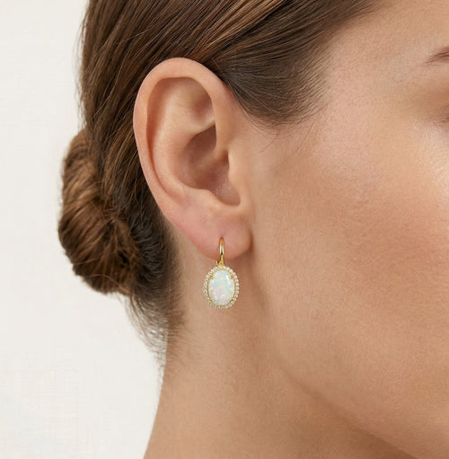 Massive oval white opal gold earrings