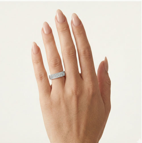 Three-row gold diamond band.