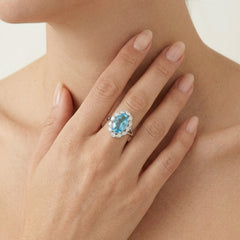 Stříbrný prsten Halo s modrým topazem a kubickými zirkony