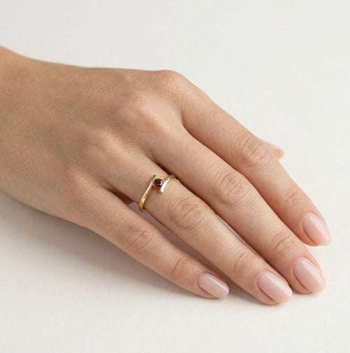 Unique garnet ring with tension setting