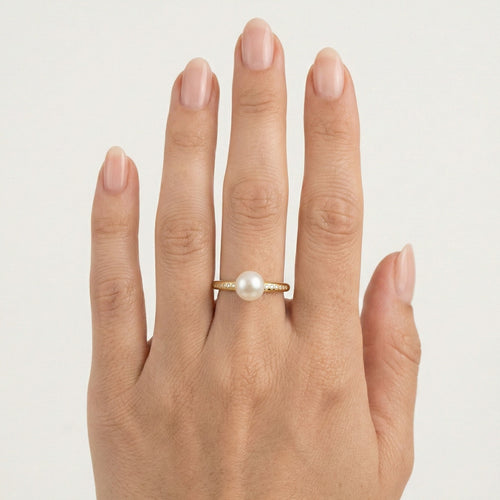 Bague en or avec zircon cubique et perle