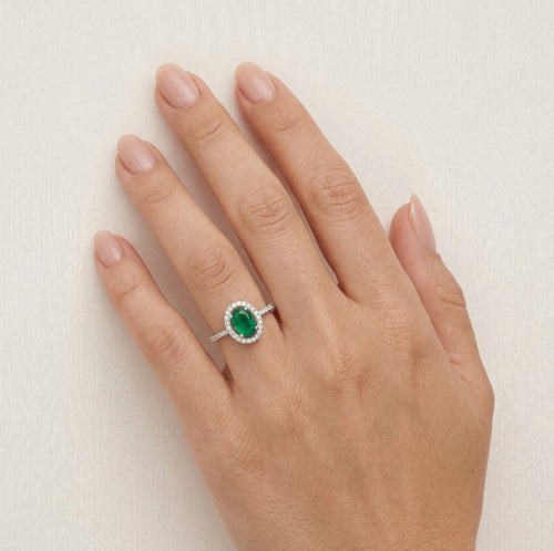 Sterling silver halo ring with oval emerald