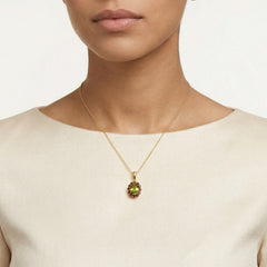 Royal Radiance en oro amarillo con piedras de moldavita y granate