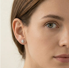 Silver halo earrings with oval cubic zirconia