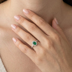 Sterling silver halo ring with oval emerald
