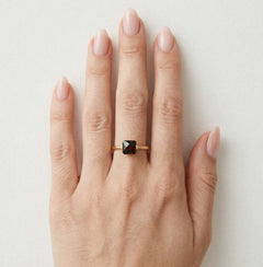 Princess cut solitaire garnet yellow gold ring