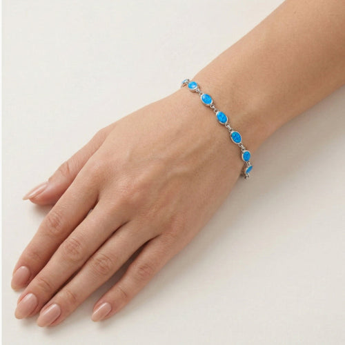 Sterling silver bracelet with blue opal accents