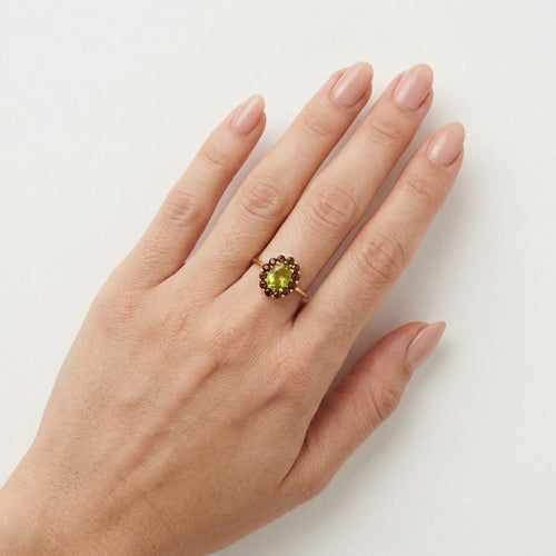Moldavite and garnet ring in yellow gold