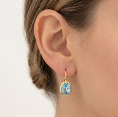 Pendientes de oro con topacio azul ovalado