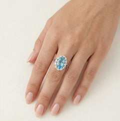 Stříbrný prsten Halo s modrým topazem a kubickými zirkony