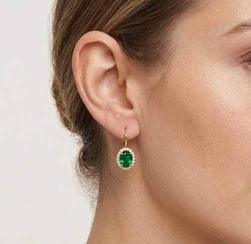 Ohrstecker mit oval geschliffenen Smaragden und Halo