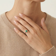 White gold diamond ring with round emerald