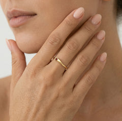 Gold ring with round cut garnet