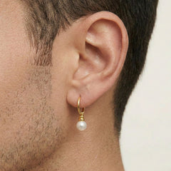 Yellow gold hoop with dangling pearl earring