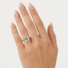 Yellow gold ring with sky blu topaz