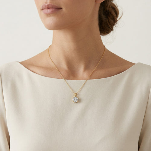 Four prong gold pendant